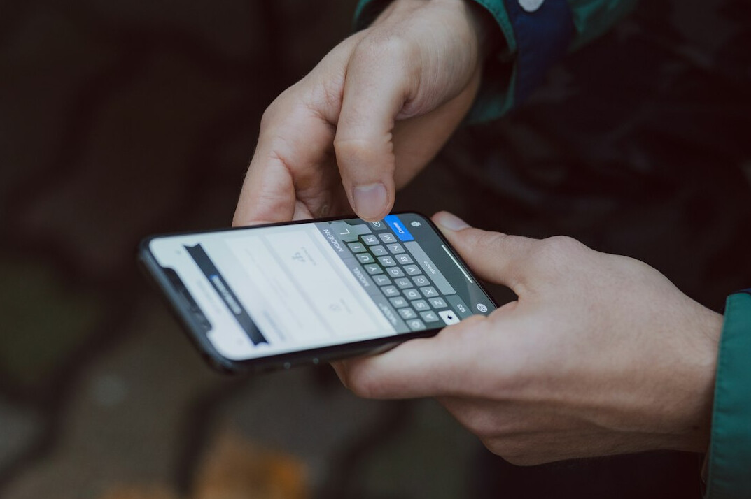 person using smartphone with ai