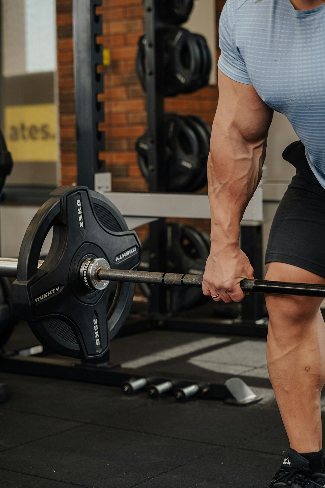 person lifting weights in gym